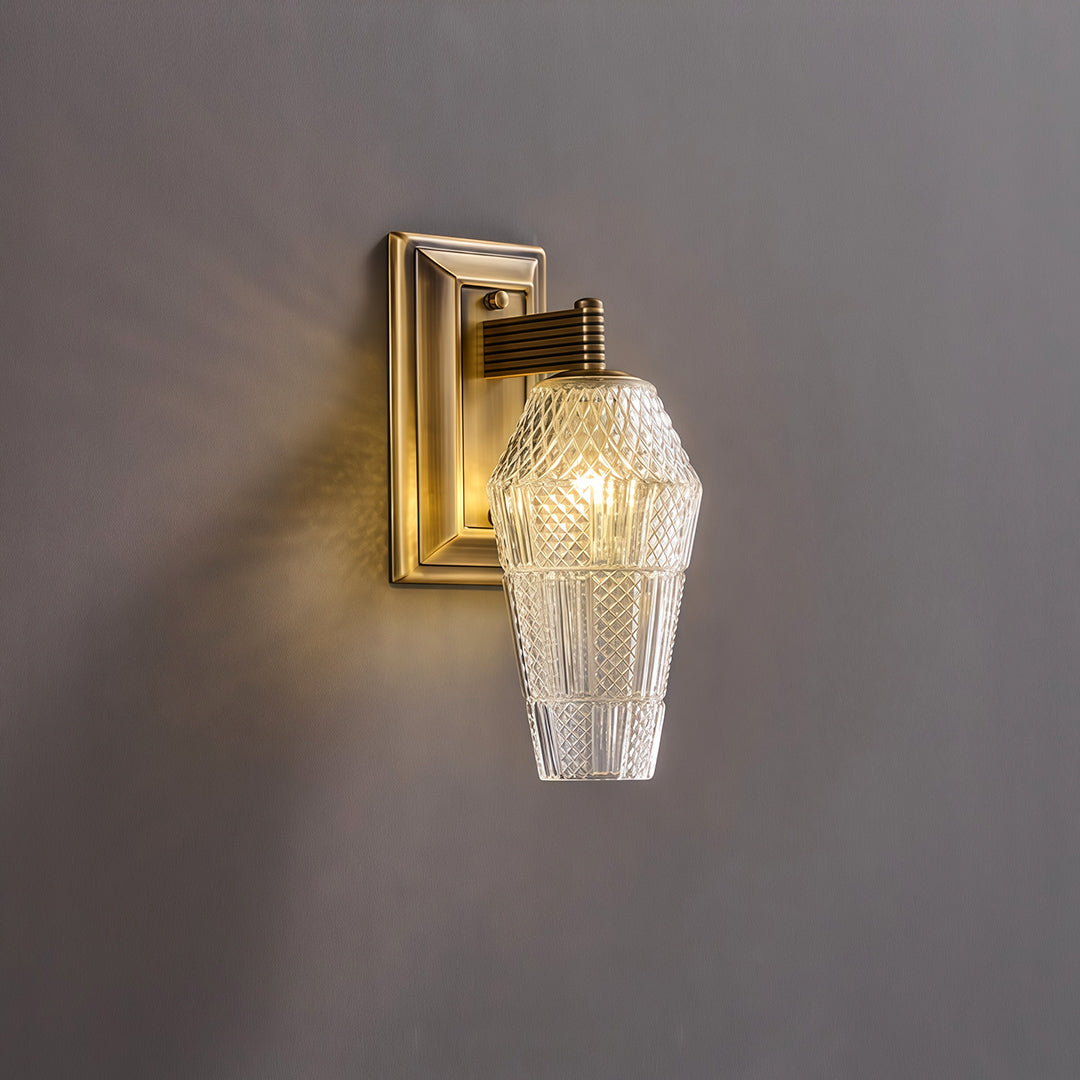 Elegant LED wall sconce lights featuring glass shade chandelier aesthetic shown illuminated on gray wall highlighting crystal texture.