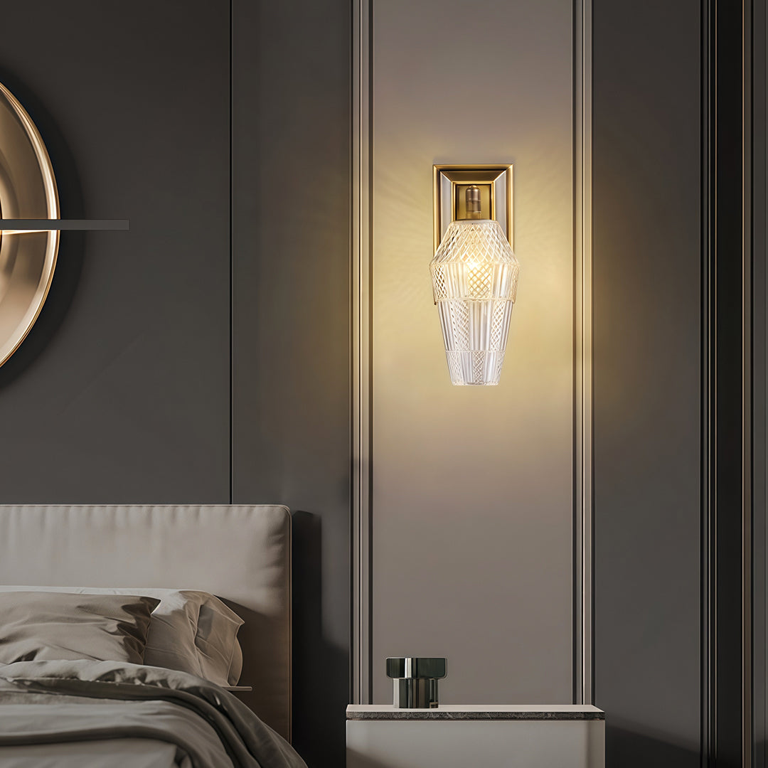 Elegant LED wall sconce lights with glass shade chandelier design providing ambient lighting on gray accent wall beside mirror.