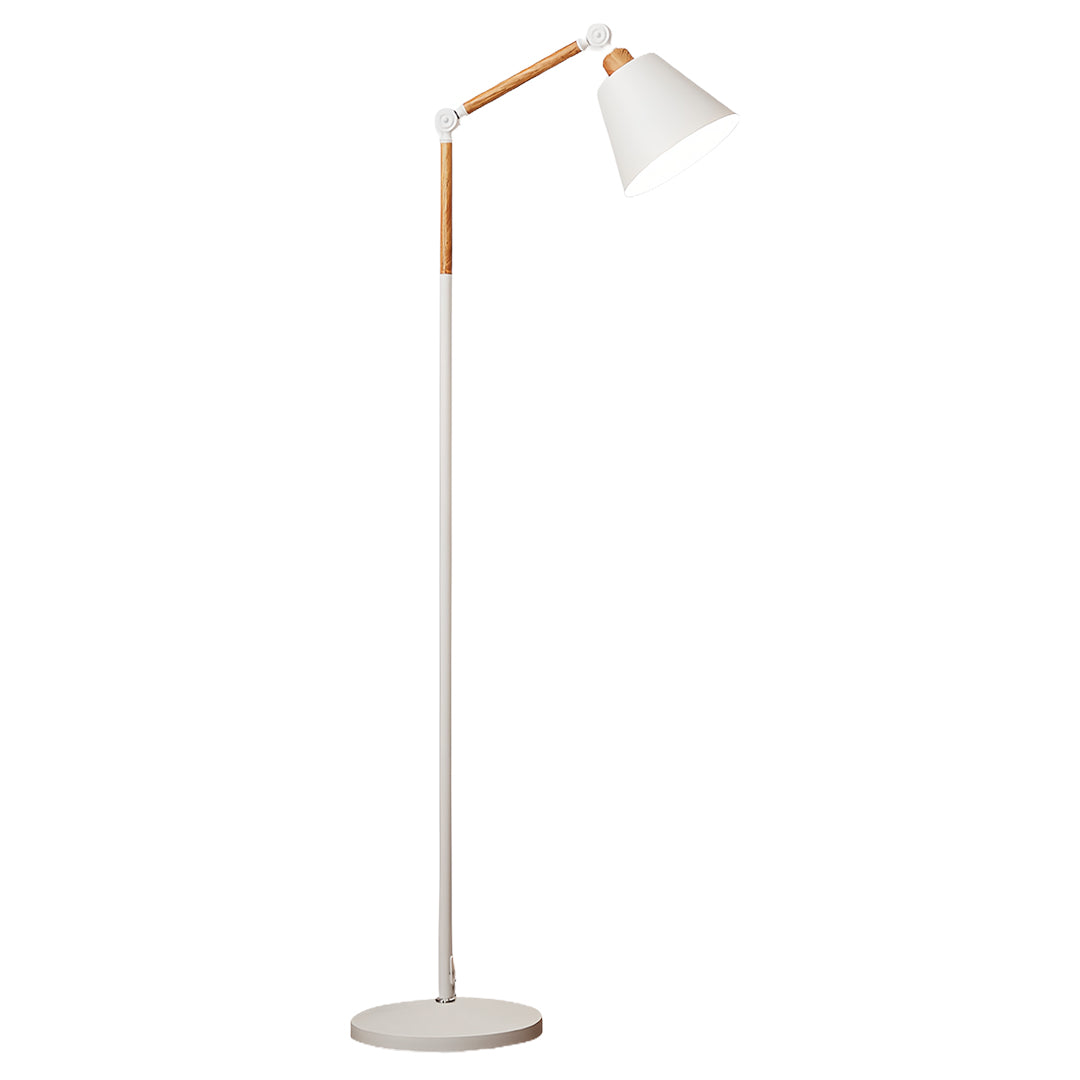 Elegant metallic floor lamp with black directional shade and copper accents beside modern sofa