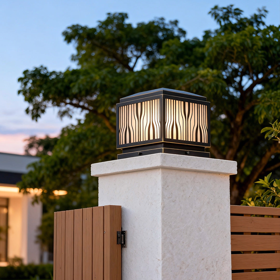 Elegant modern solar pillar lights enhancing a garden pathway with warm, inviting light.