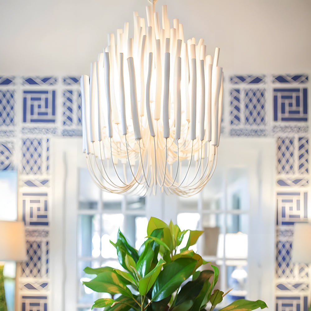 Elegant organic stick chandelier hanging in a modern dining room, adding sophistication with its intricate design.