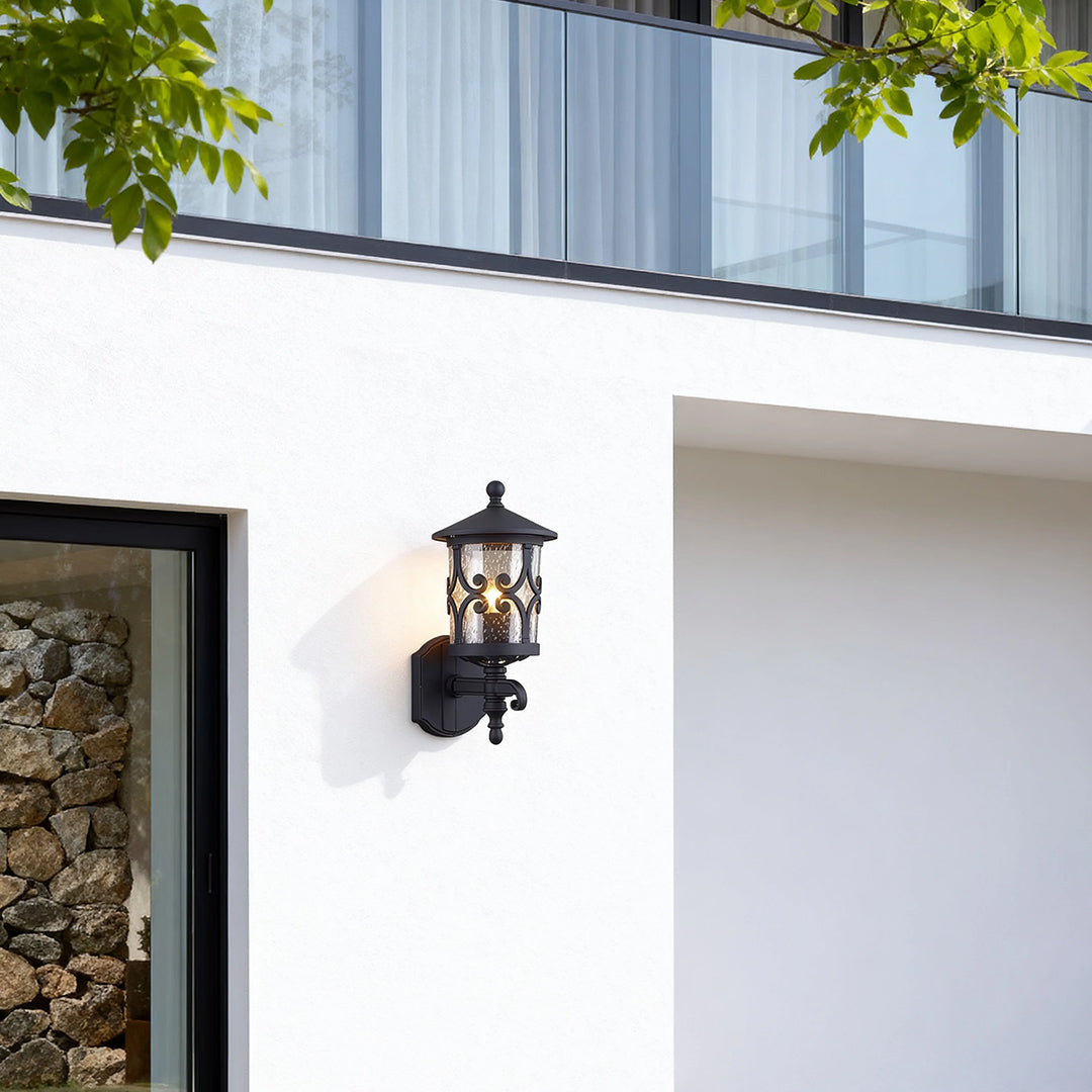 Elegant outdoor black sconce installed on white modern home exterior near contemporary entrance