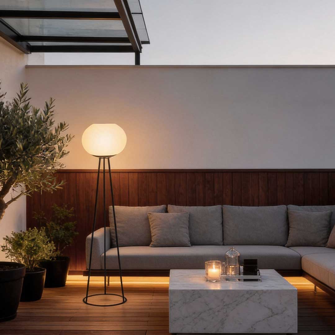 Elegant outdoor LED floor light with a white globe shade, perfect for illuminating patio spaces and creating a cozy outdoor ambiance.