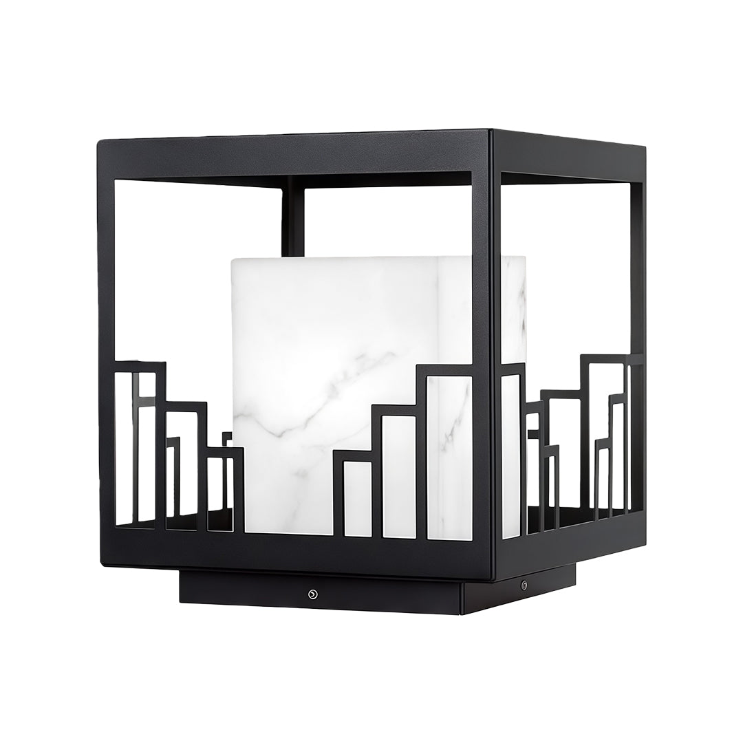 Elegant outdoor pillar light featuring glass shade chandelier design in black metal frame with decorative building silhouette pattern.