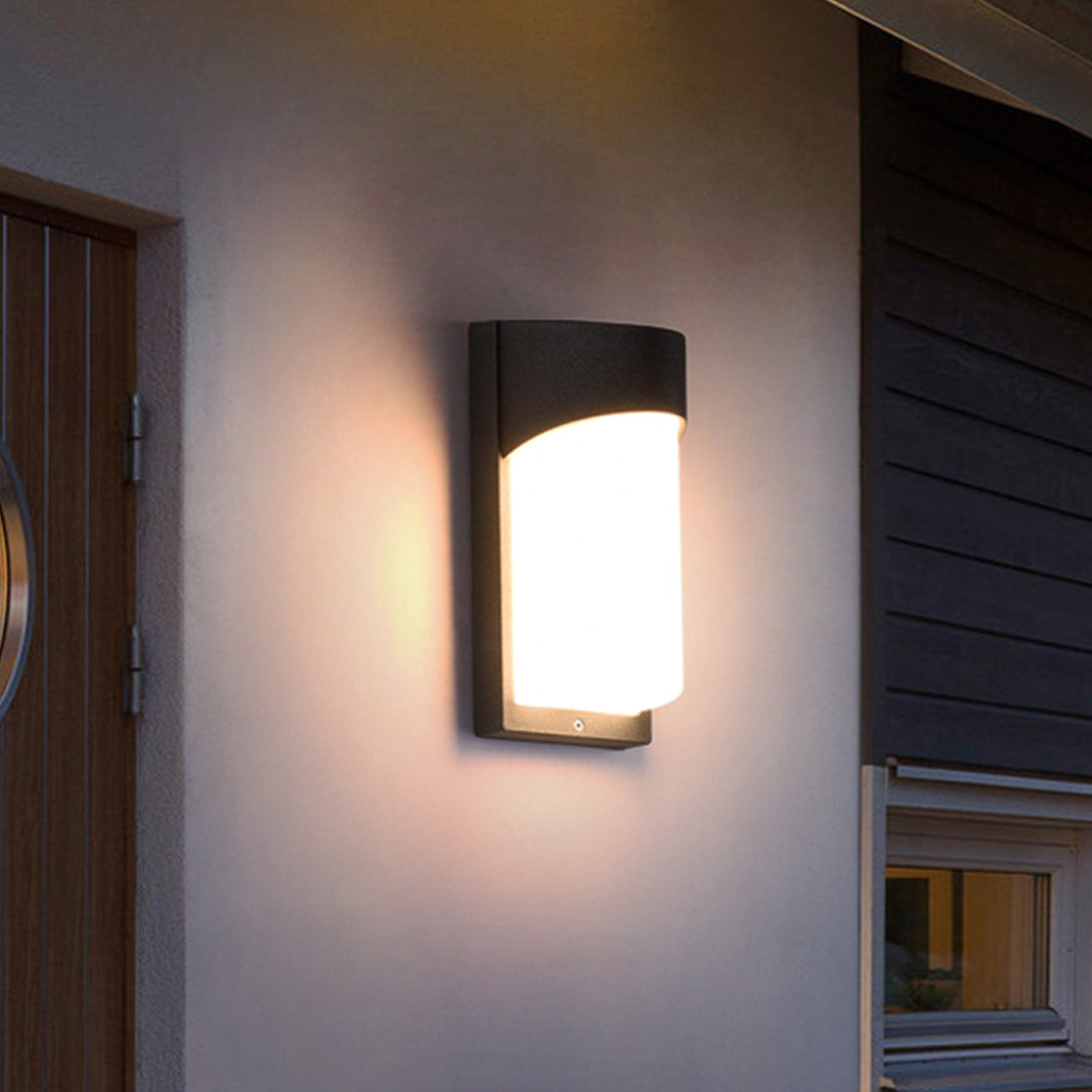 Elegant outdoor wall lighting fixture creating sophisticated illumination on modern building facade