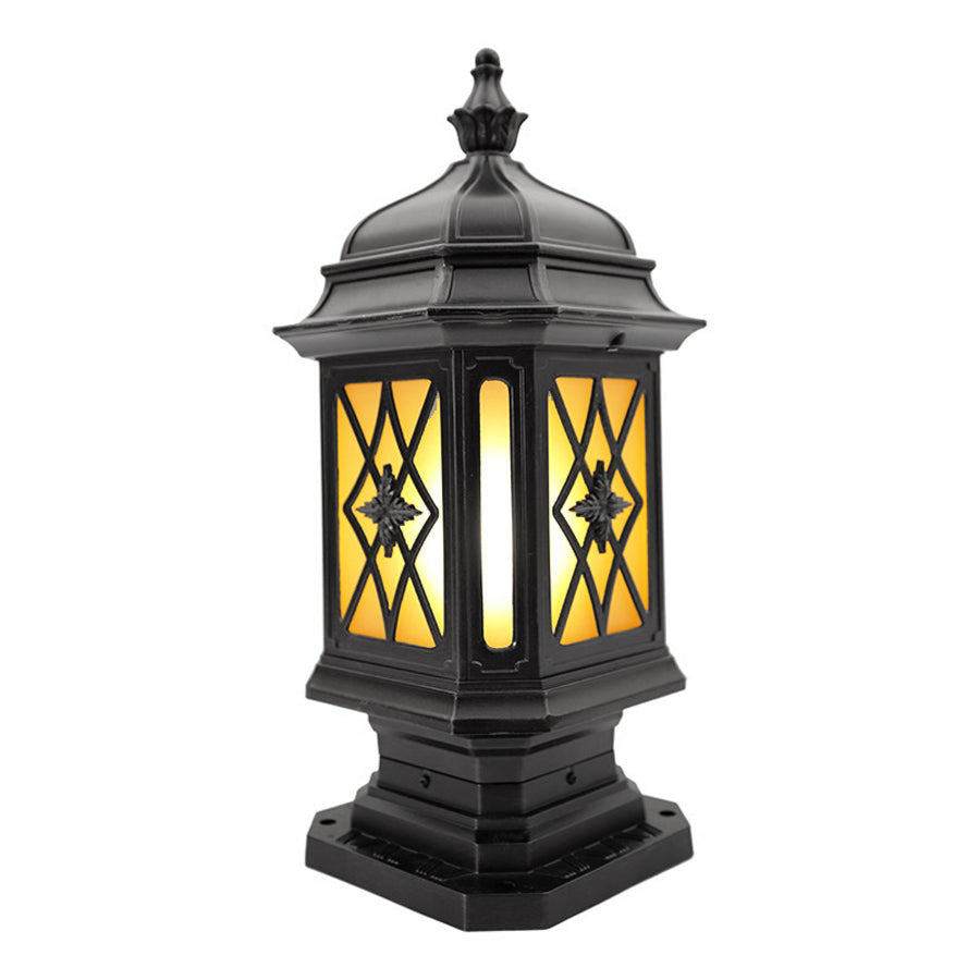 Elegant outside pillar light with amber-colored glass panels and traditional black metal framework for garden lighting