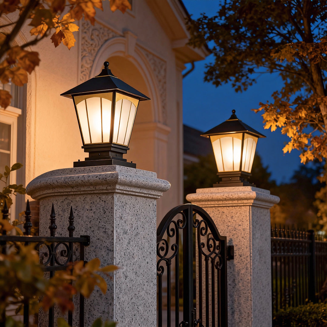 Elegant pillar lights for house mounted on a brick pillar, enhancing the charm of a residential gate.