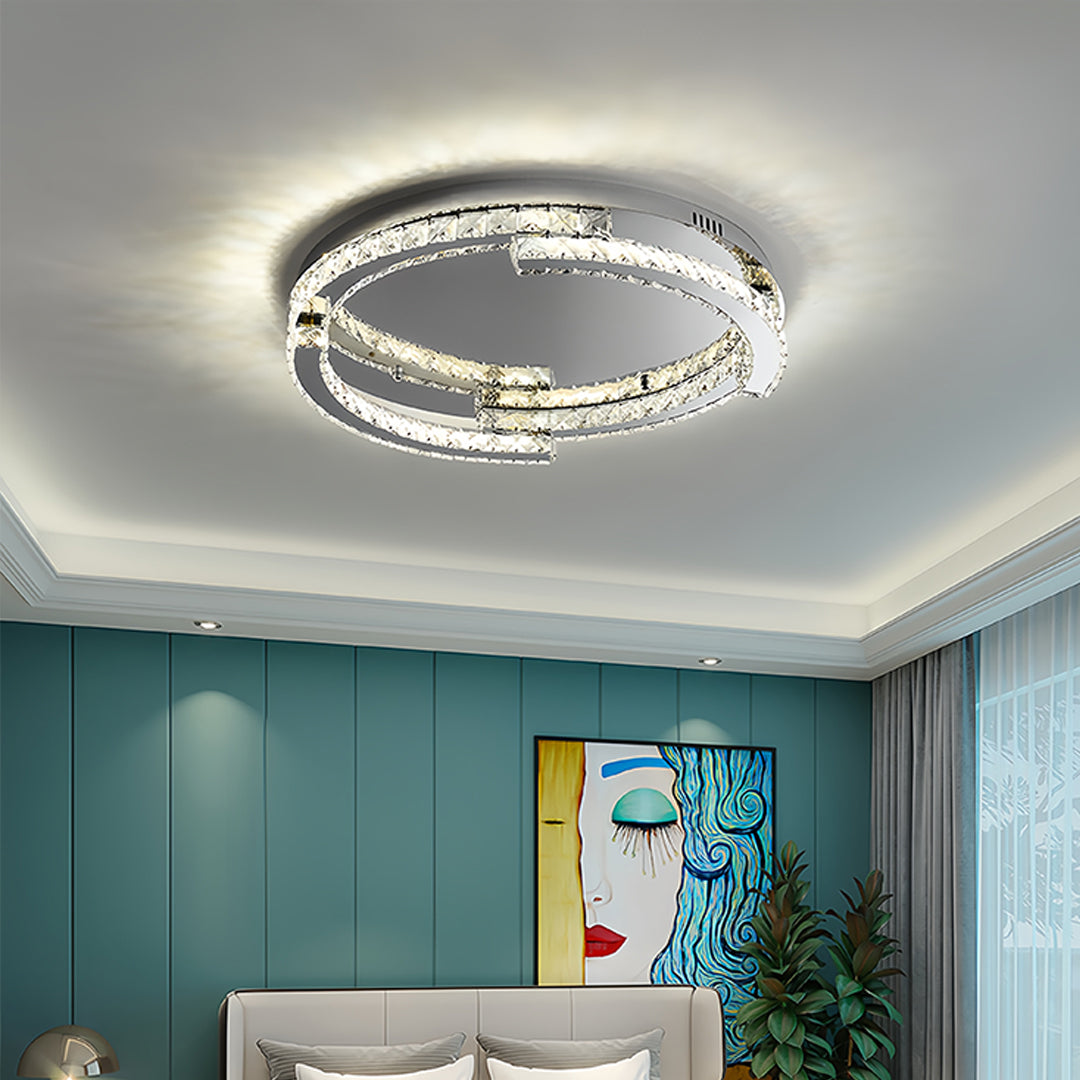 Elegant silver flush mount ceiling light mounted in contemporary living room with teal accent wall
