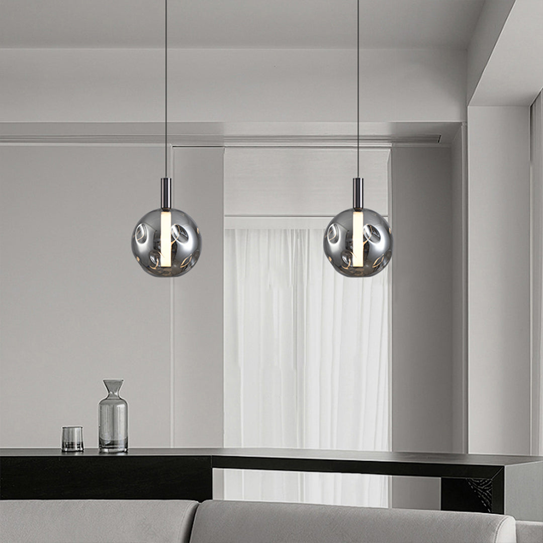 Elegant drum pendant lights creating sophisticated ambiance in minimalist dining room