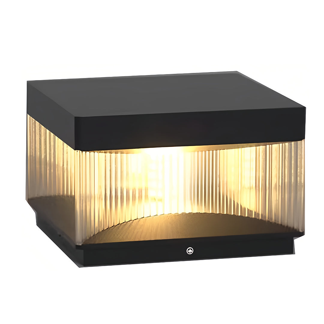 Elegant square pillar lights with dark gray cap and warm glowing vertical slat design
