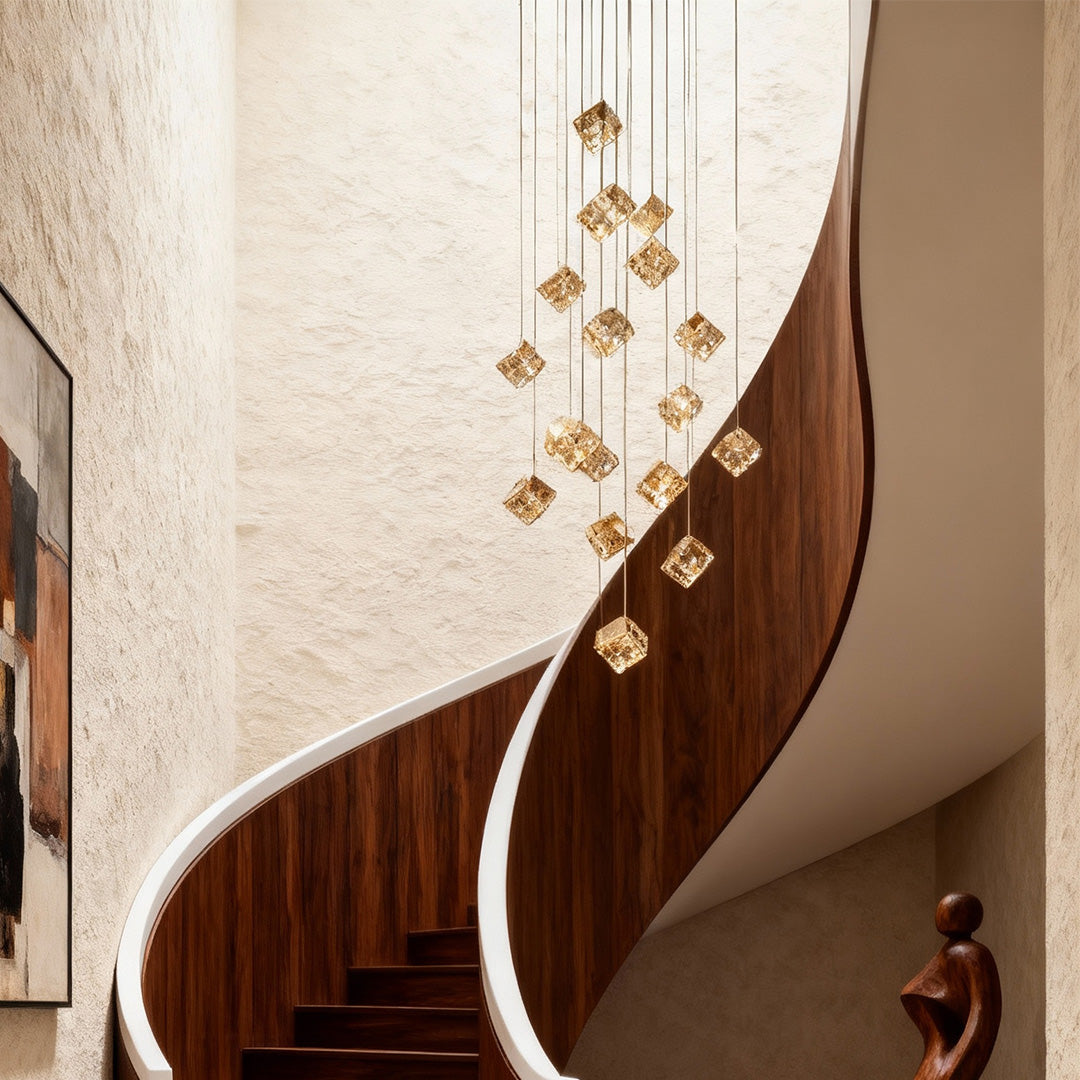 Elegant crystal chandelier illuminating staircase with art deco accents.