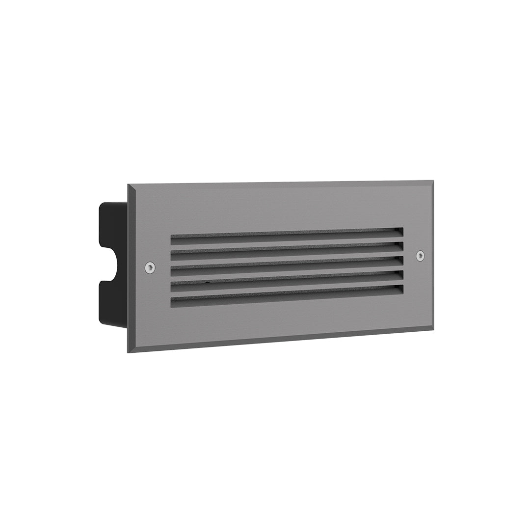 Elegant stone wall integration with built-in LED lighting creating warm ambiance in outdoor garden setting