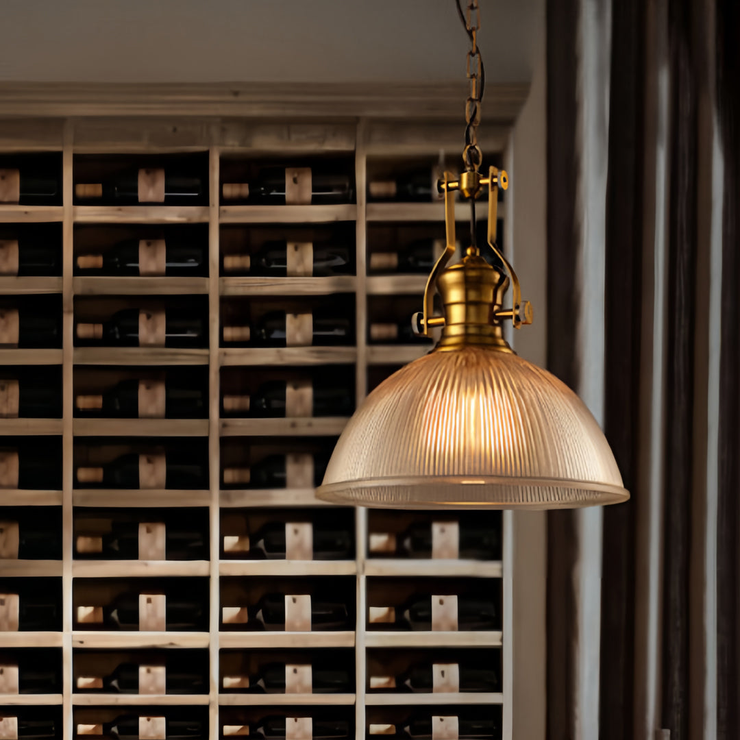 Elegant textured glass pendant light featuring golden dome shade with brass accents for warm ambient lighting