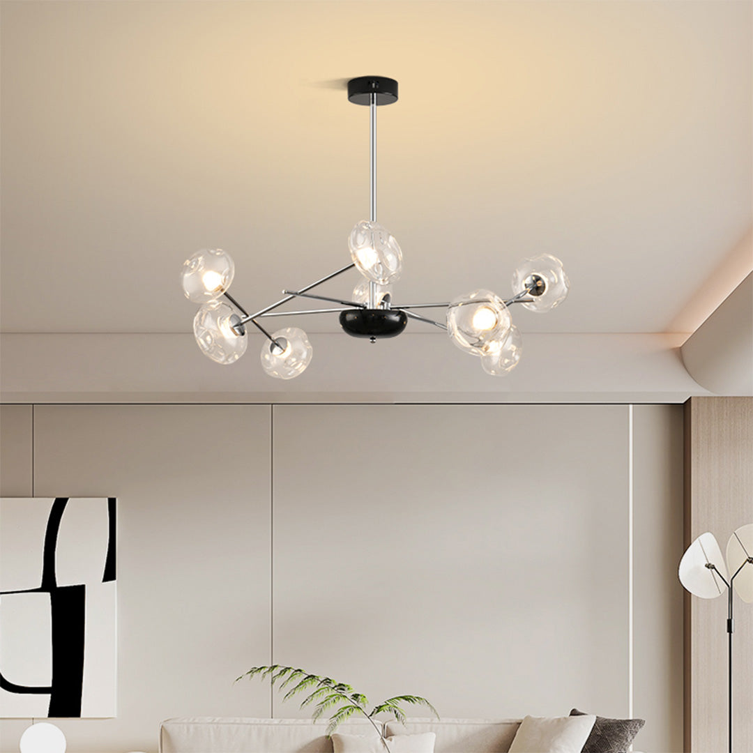 Modern LED chandelier lights providing elegant illumination in stylish living space with clean white decor