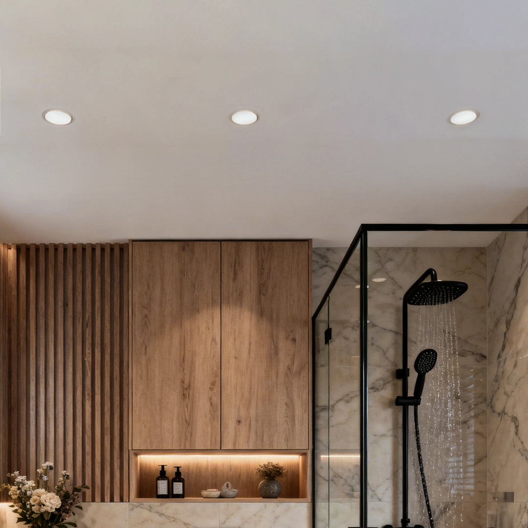 Bathroom interior featuring moisture-rated elite lighting can lights recessed into the ceiling.