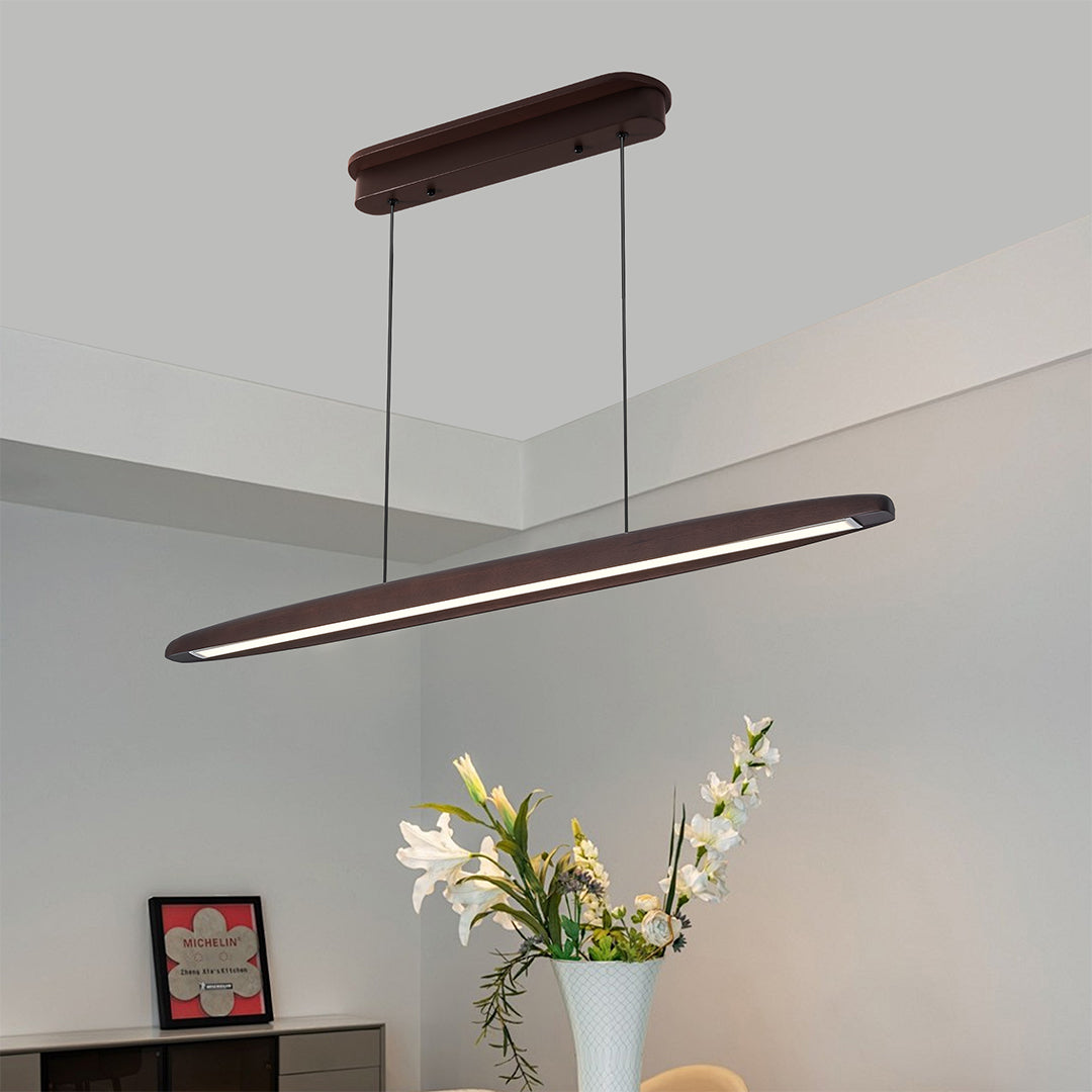Add elegance to your dining area with linear LED pendant lighting in dark wood finish, providing modern, ambient lighting and a chic design.