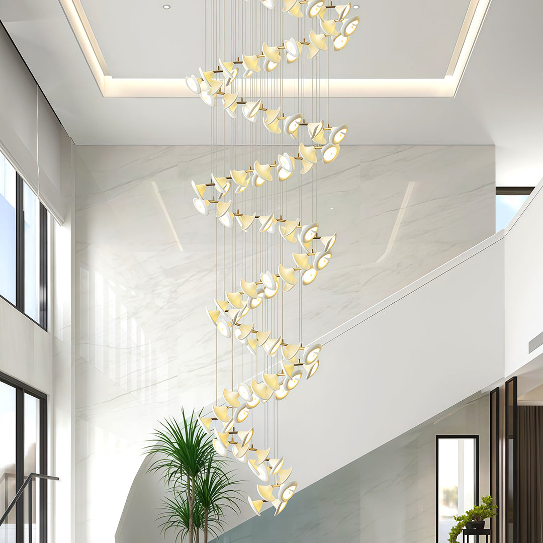 Brass spiral chandelier illuminating a contemporary entryway.