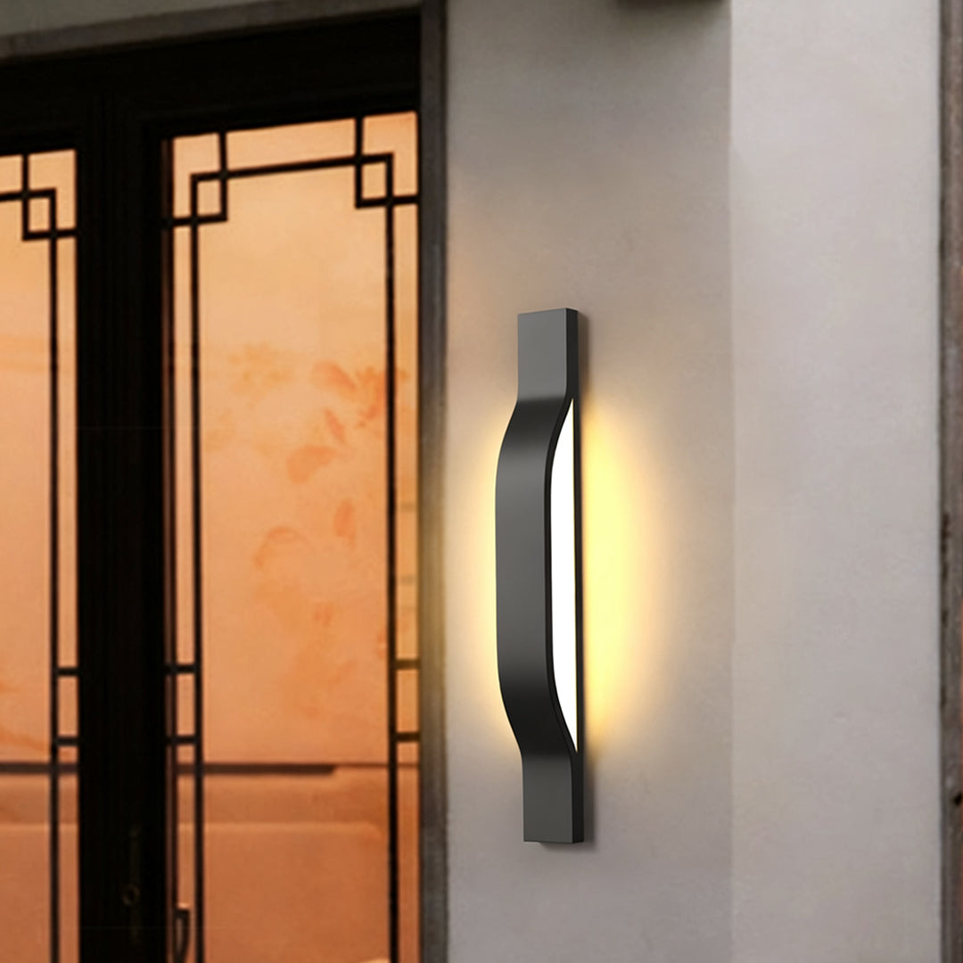 Outdoor exterior wall lights illuminating an entryway with soft warm light in a modern home setting.