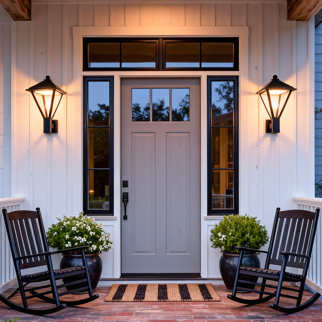 Symmetrical pair of lantern outdoor wall lights flanking a front door, creating a welcoming entry and highlighting decorative wall mounted lights outdoor.
