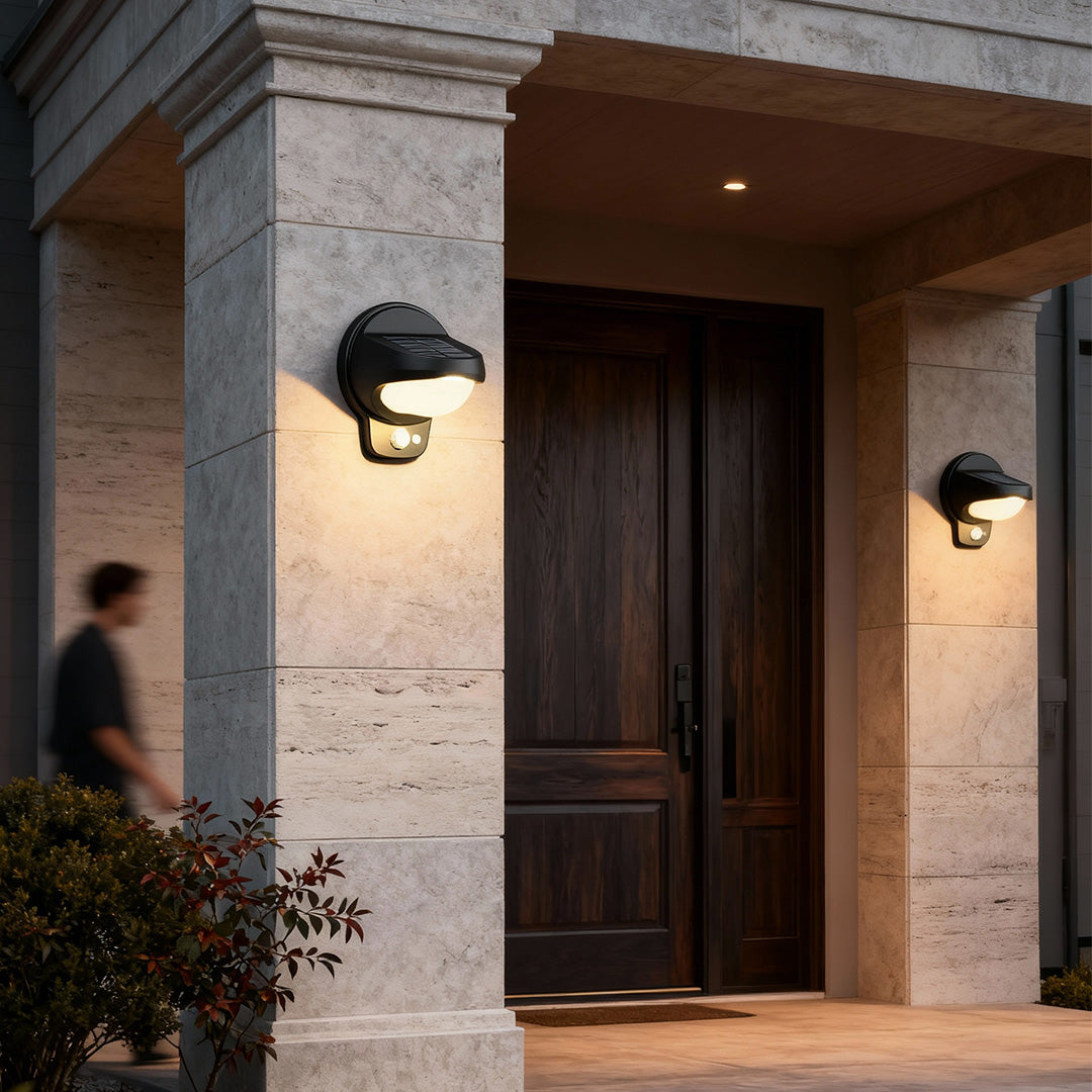 Vintage outdoor wall lights mounted at a home entrance with a warm welcome glow.