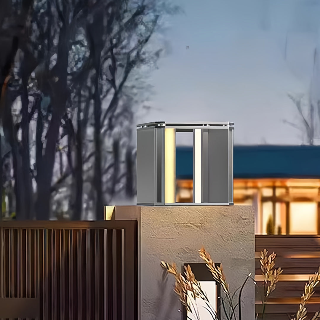 Outdoor evening scene featuring silver main gate pillar light design illuminating residential gate columns.