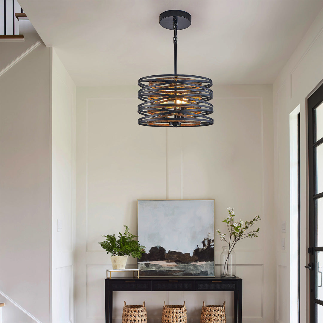 Black drum pendant light with exposed bulbs, adding character to modern interiors.