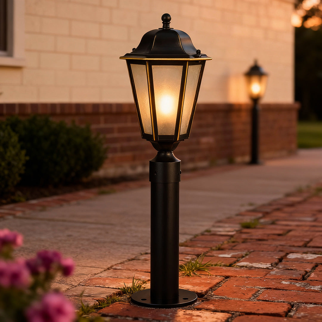 Exterior path lighting enhancing a brick pathway at dusk, creating a warm and welcoming entrance.