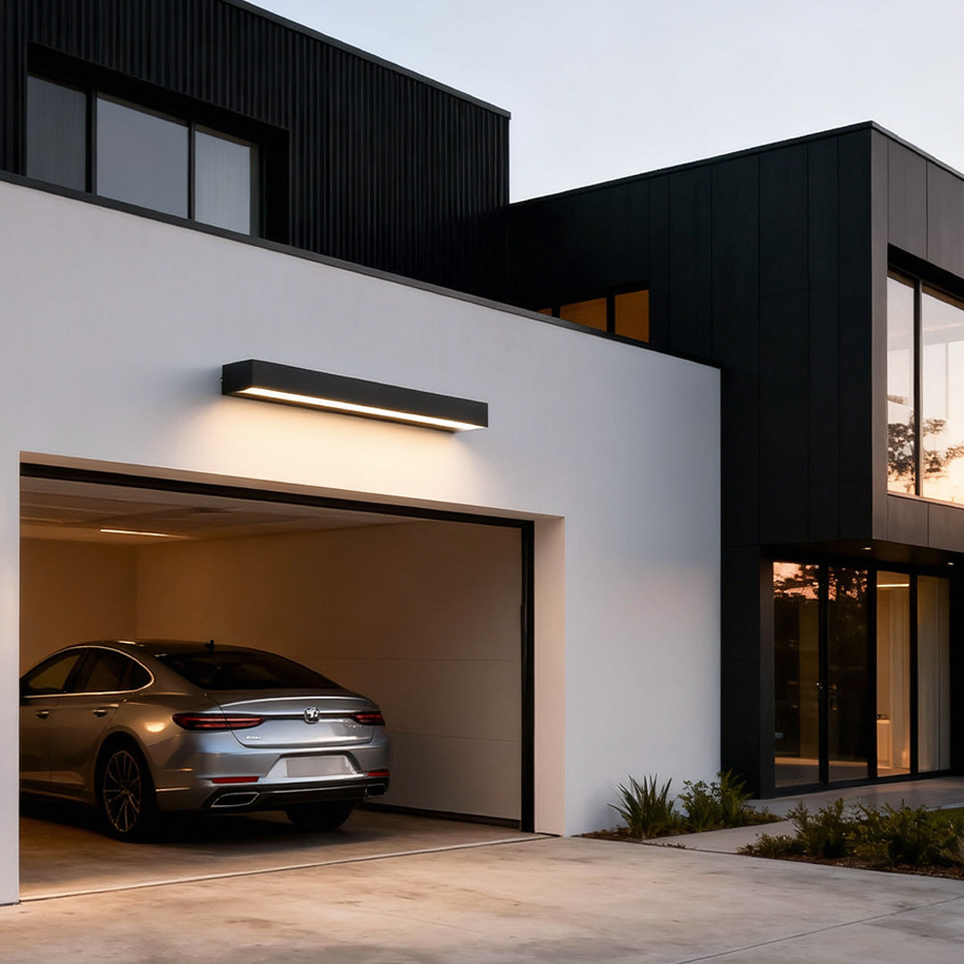 Modern exterior porch light fixtures with slim rectangular design mounted in the garage.