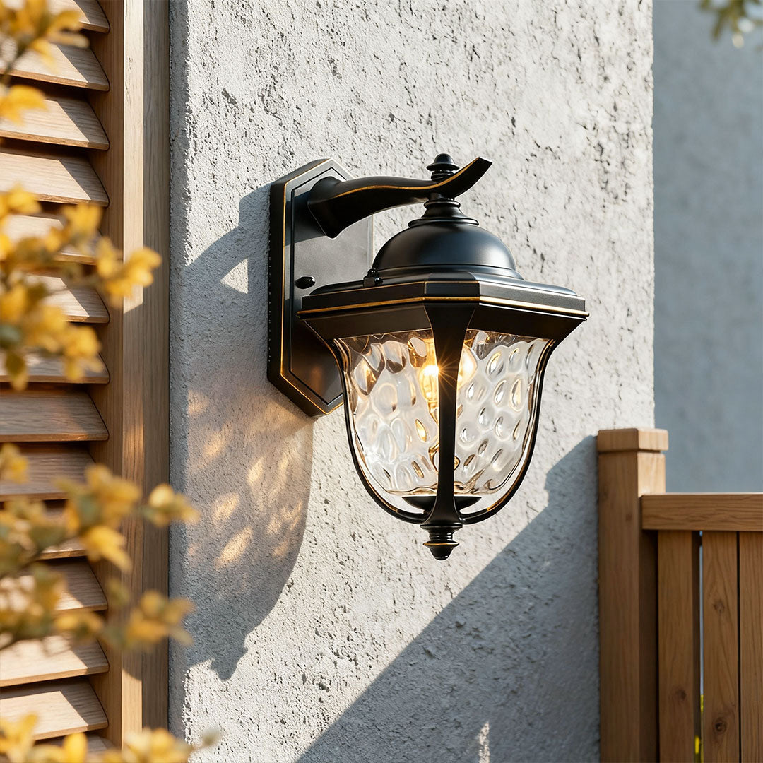 Bright outdoor wall lights installed on exterior siding with warm lighting.