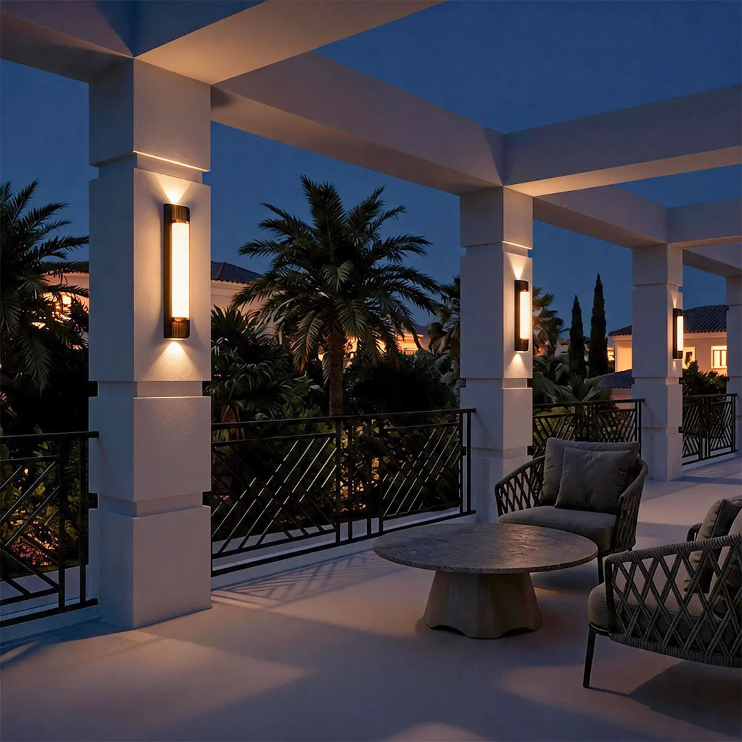 Up down outdoor wall sconce mounted on a contemporary exterior wall with symmetrical light beams.