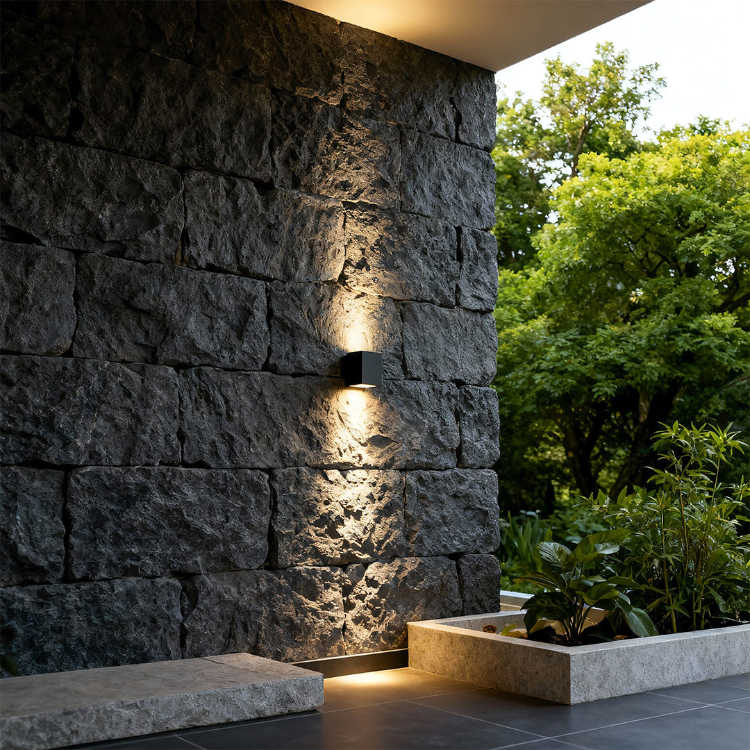 Wall wash light mounted on villa exterior, highlighting the façade.