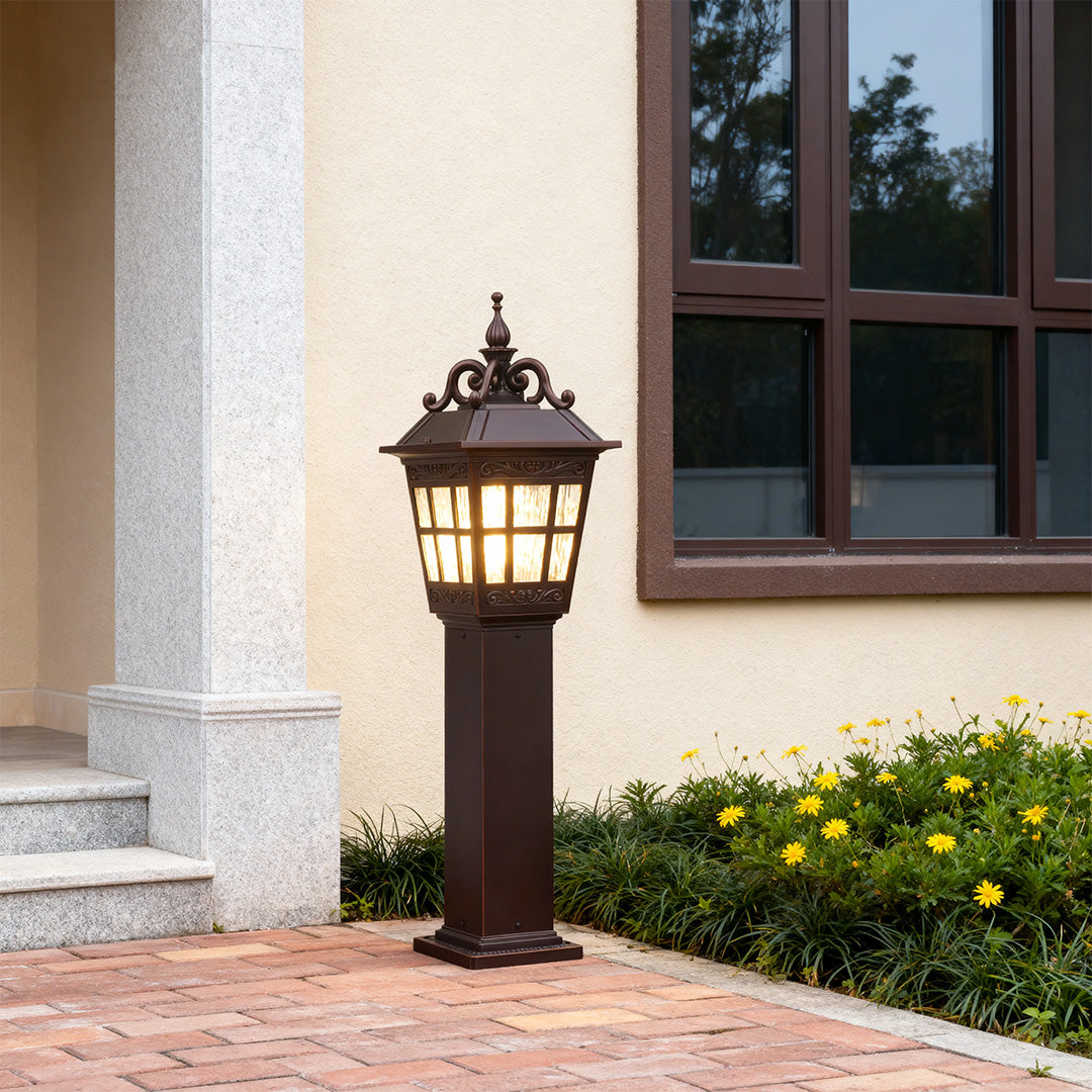 External post lights enhancing a house entrance with a decorative stone pathway.