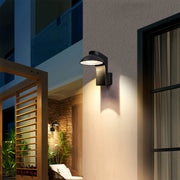 Modern extra large outdoor wall sconce lighting up balcony and patio entrance.