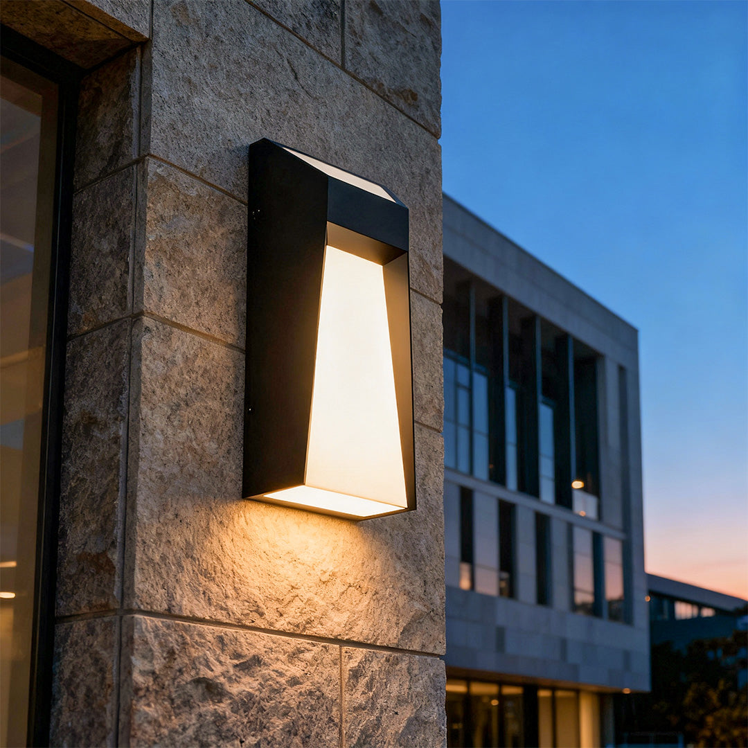 Extra large outdoor wall lights installed on modern building facade creating dramatic upward and downward lighting effect