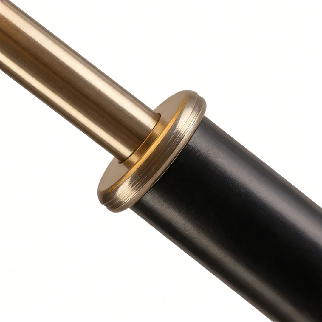 Fabric table lamp with a beige shade, providing warm light in a modern living room.