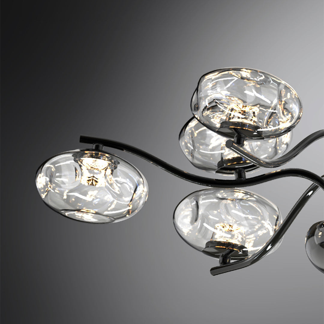 Close-up detail of modern LED chandelier featuring individual faceted glass shade with warm LED illumination