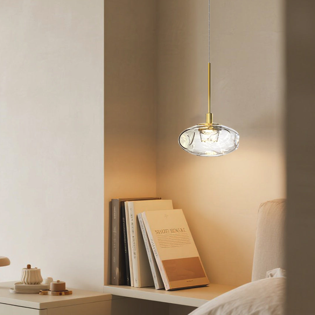 Small glass pendant lights with faceted shade enhancing warm wooden interior with modern lighting solution