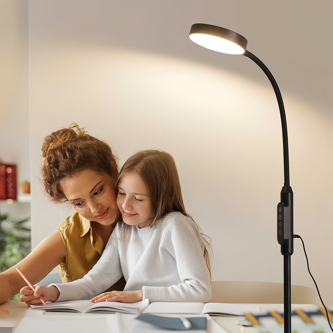 Family using led reading floor lamp for activities with children in bright modern interior space