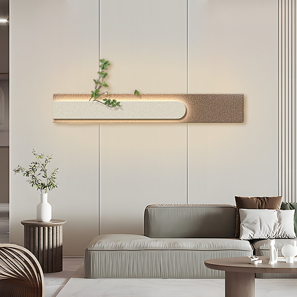 Faux sandstone wall light illuminating a minimalist living room with elegant light.