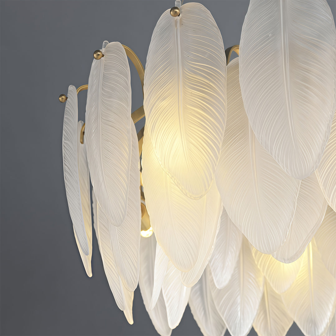 Feather chandeliers artistic close-up highlighting organic glass petal shapes and lighting