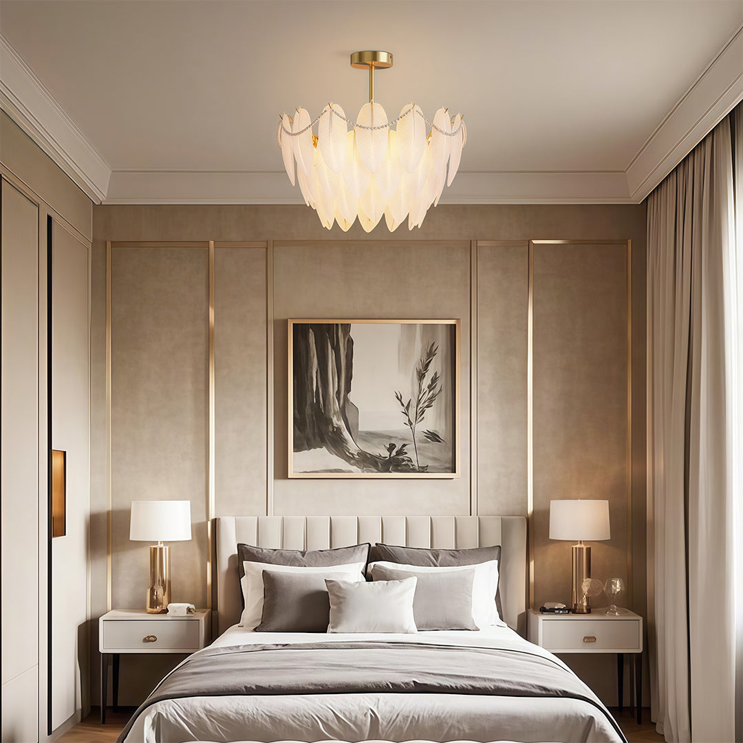 Feathers chandelier lighting cozy living area with comfortable sofa and decorative pillows