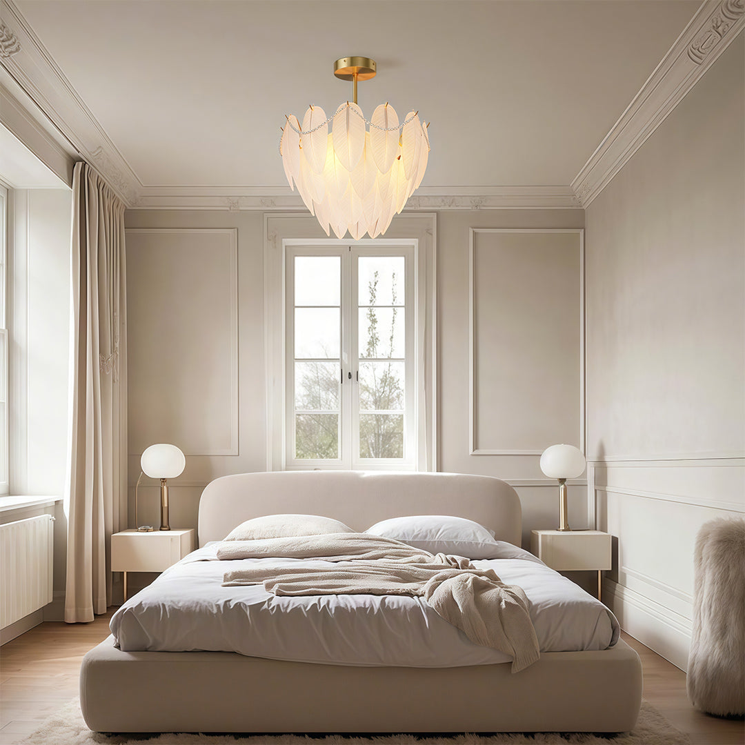 Modern luxury chandeliers creating romantic atmosphere in master bedroom with plush bedding