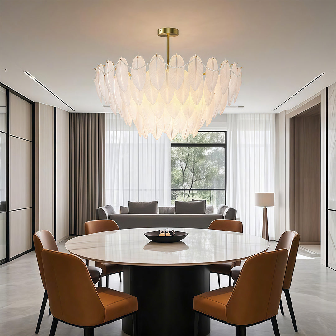 Modern luxury chandeliers lighting sophisticated entryway with console table and mirror