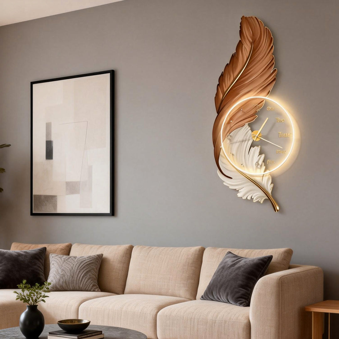 Decorative feather LED wall lamp with circular halo light on a gray accent wall.