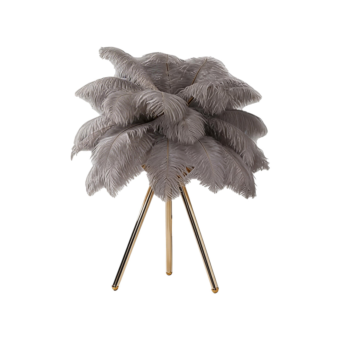 Feather table lamp with a black feather design, enhancing a modern interior.
