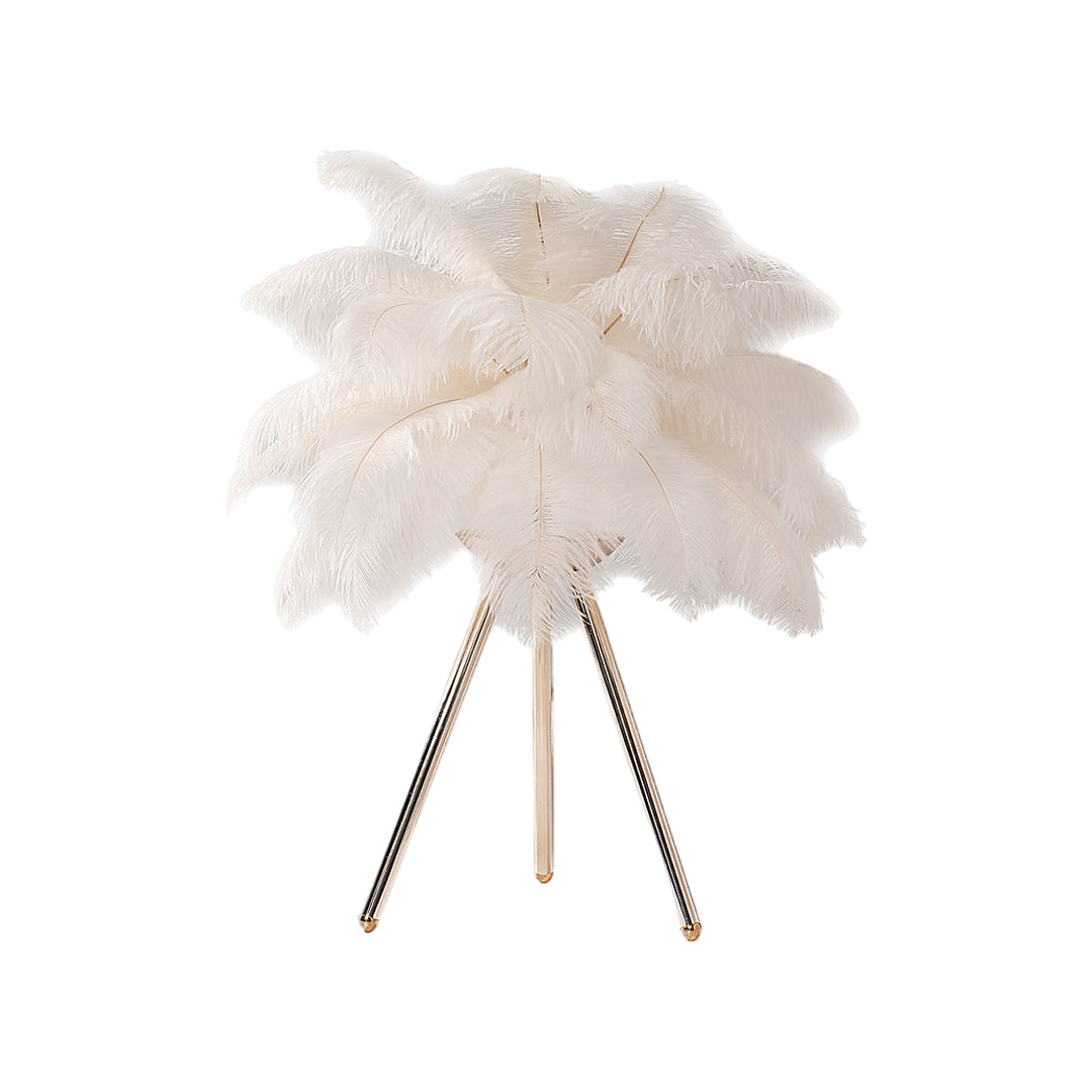Feather table lamp with a pink feather design, providing warm illumination.