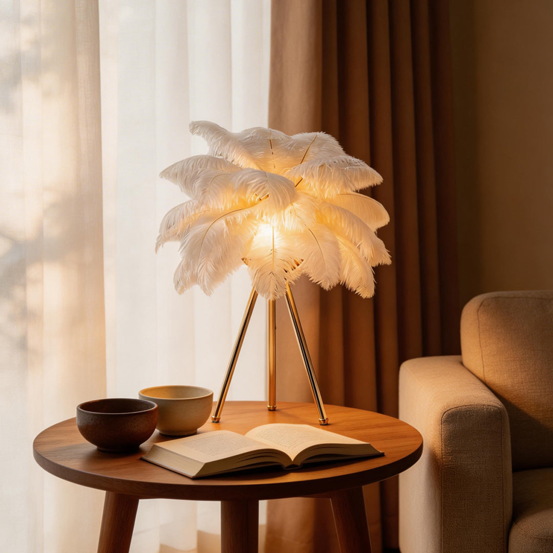 Feather table lamp with a white feather design, placed on a wooden side table.