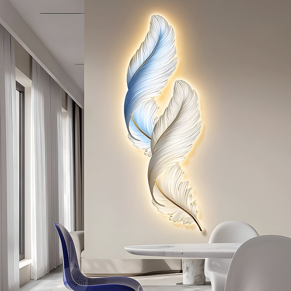 Feather wall decor light installed in a dining space, blending artistic form with warm decorative illumination.