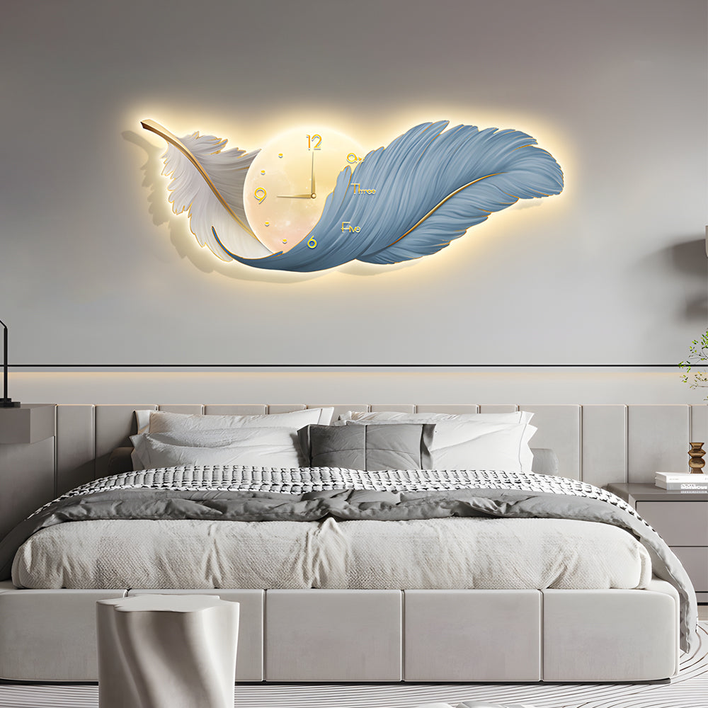 Feather wall lamp installed above a bed, blending artistic design with gentle LED backlighting.