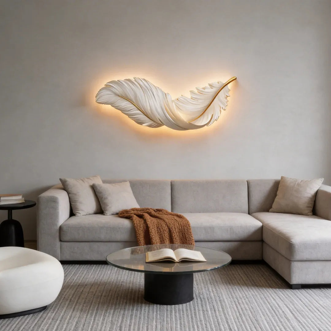 Feather wall lamp mounted above a modern sectional sofa, showcasing an elegant feather-inspired design with warm glow.